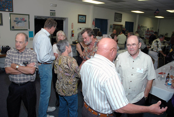Jim Erickson talking with Bob Alexander (left side)